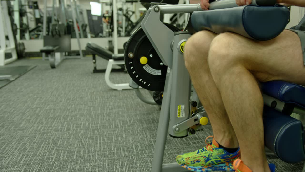 Powerful Man Exercising In Gym