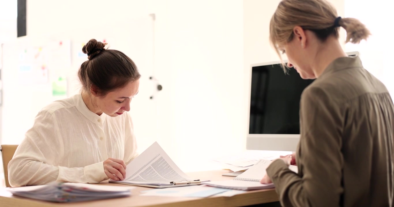 Engaging discussion and collaboration between two professionals in a bright office setting