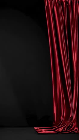 red silk curtain on black background