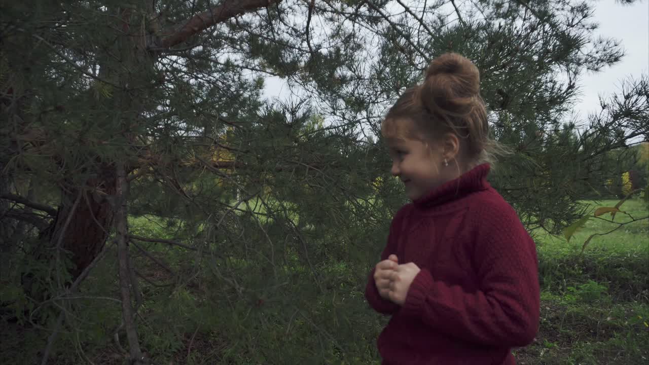 Happy Girl Playing Outdoors in Autumn