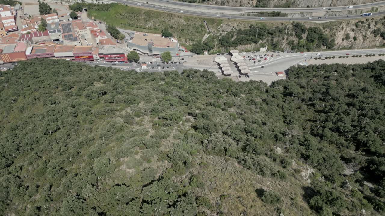 Aerial fly lush green Pyrinean mountain French Spanish highway border Le Perthus
