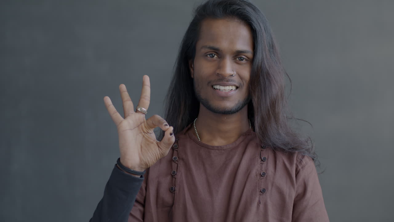 Smiling Man Making Ok Gesture