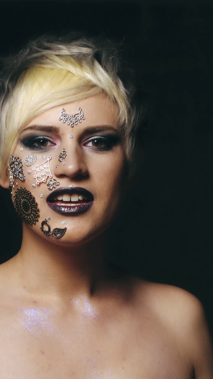 Woman holds her fingers in the heart. Cute woman holds her fingers in the heart on a black background