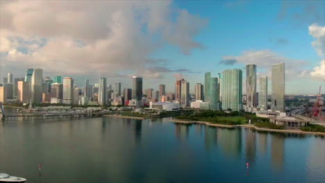 aerial 4k shot of miami skyline day with yacht