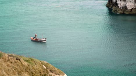 Slow-Motion-Wide-Shot-Of-A-Small-Boat-At-Sea