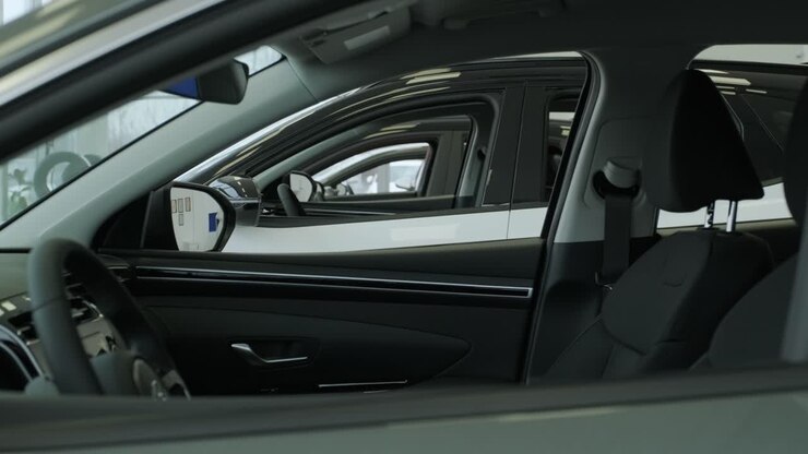Black interior of a new car close-up. A new car is sold at a car showroom