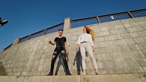couple in love dancing. happy young couple dancing together outdoor