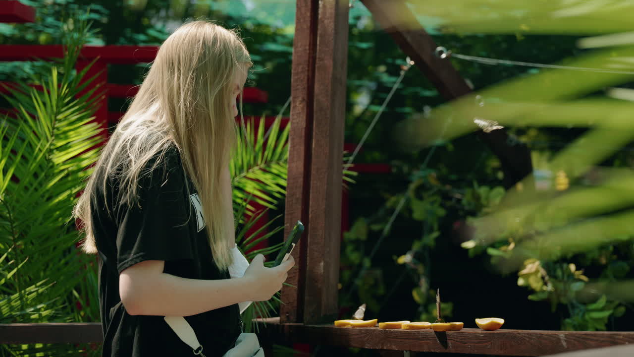 Woman taking pictures of food outdoors
