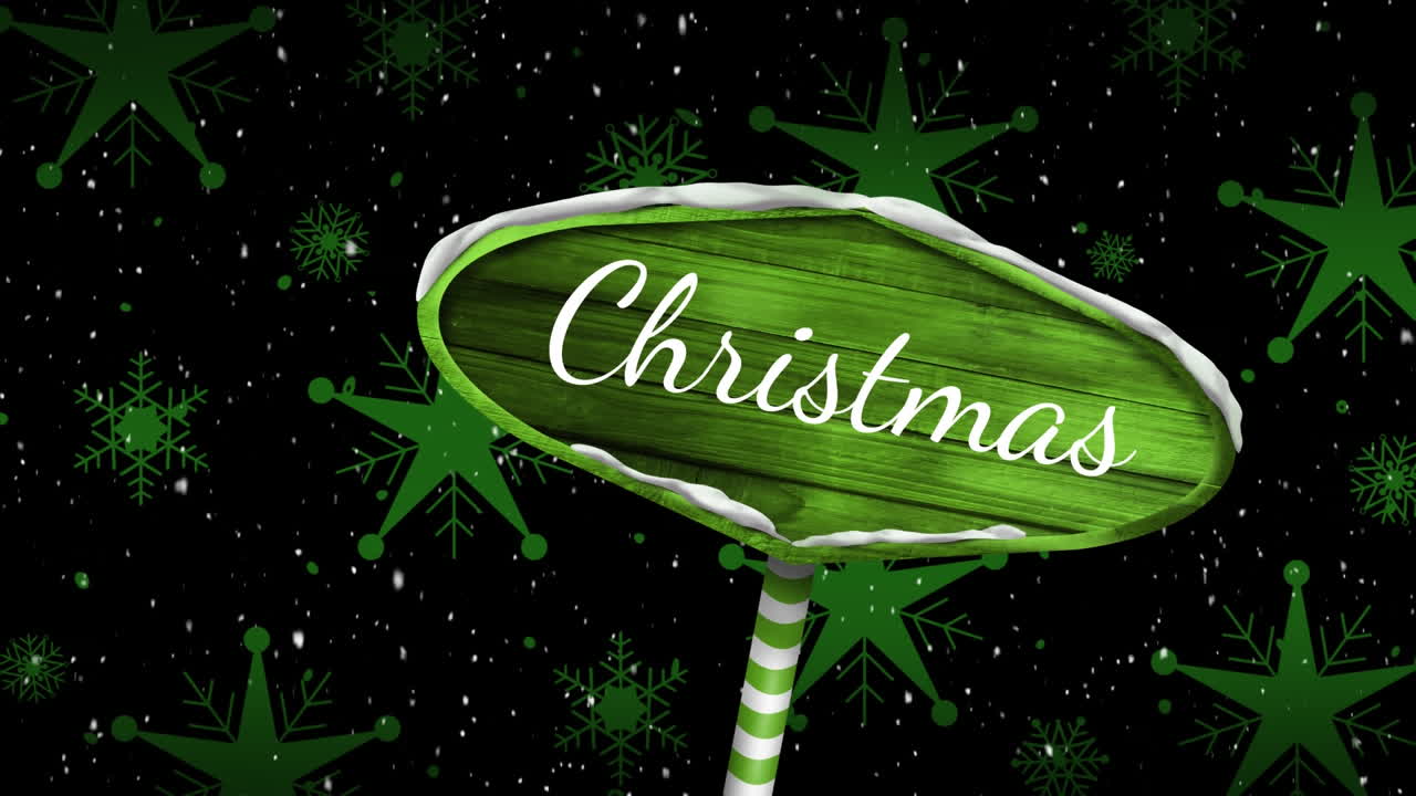 navidad escrita en un cartel de madera y nieve cayendo