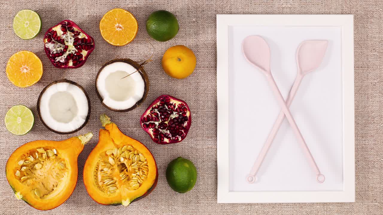 Sliced fruits appear with frame and cooking utensil. Stop motion