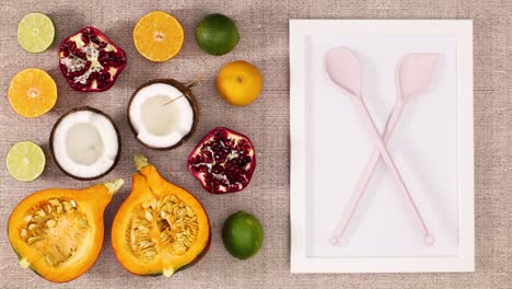 sliced fruits appear with frame and cooking utensil. stop motion