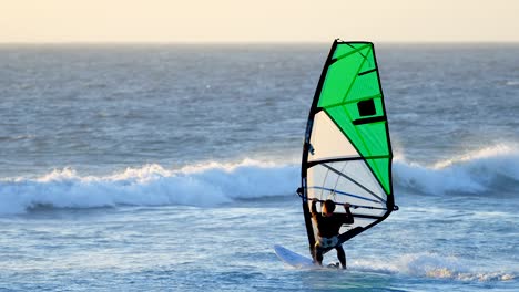 male surfer windsurfing in the beach 4k