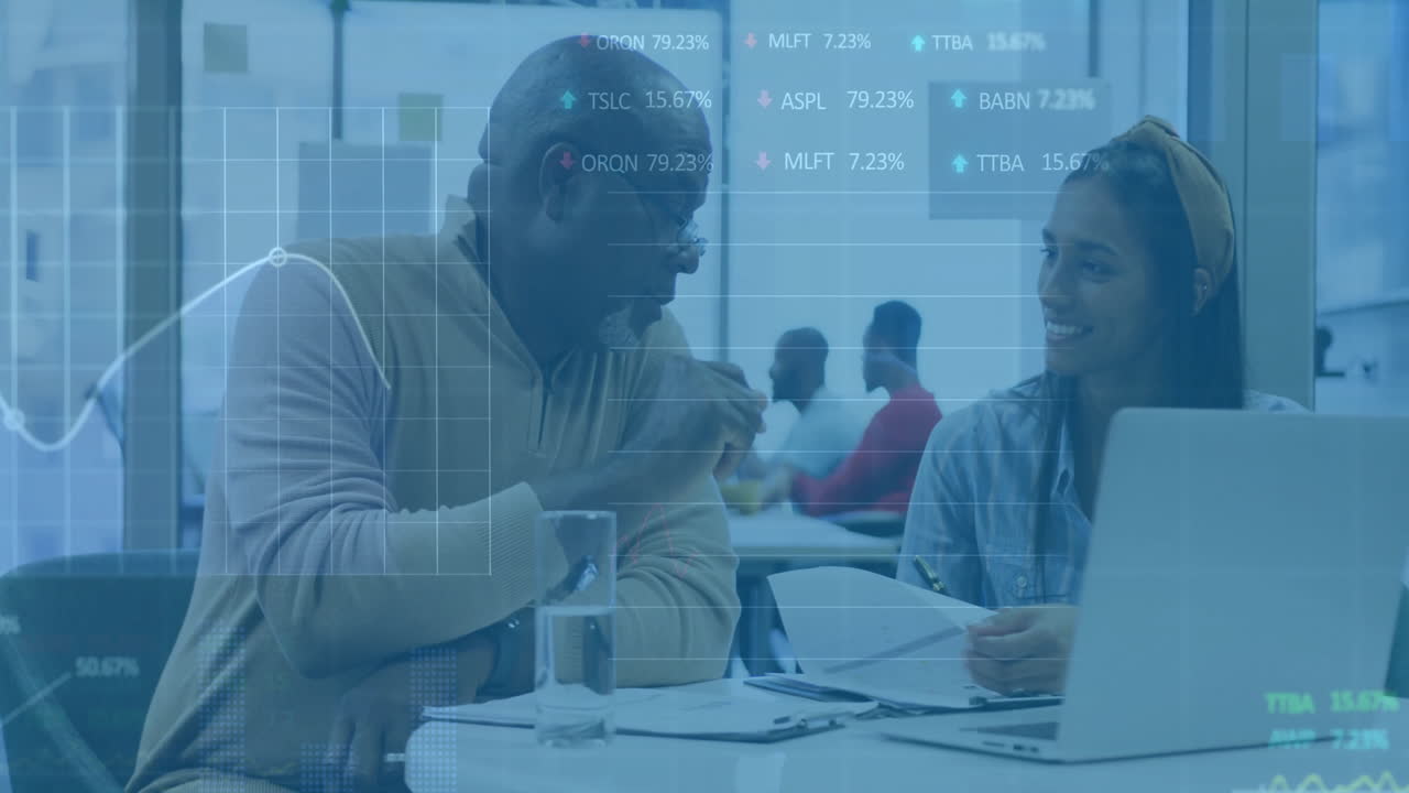 Animation of financial data processing over diverse business people using laptop