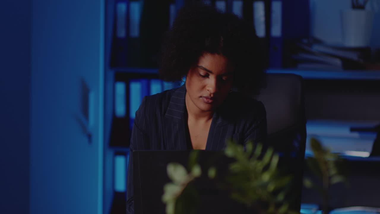 A woman working late in the office
