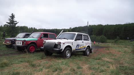 off-road rally cars in a forest