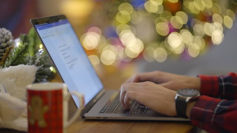 working on laptop during christmas holiday season
