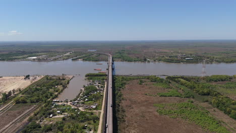 aerial view of a bridge over a wide river
