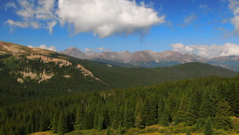 Colorful-Colorado-cinematic-aerial-drone-summer-Boreas-Pass-Breckenridge-Summit-County-power-lines-green-grass-dramatic-incredible-landscape-Rocky-Mountain-peaks-daylight-slide-right-motion