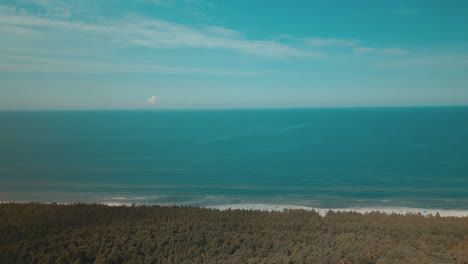 Aerial-view-of-a-beautiful-beach-with-white-sand-in-Debki-village,-Baltic-Sea,-Poland,-drone-side-movement-along-the-shore