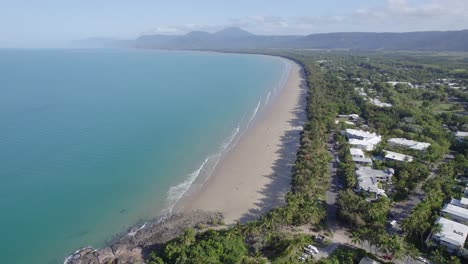 four mile beach with tropical vegetation in port douglas, australia - aerial drone shot