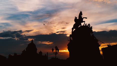 silhouette of equestrian monument at sunset
