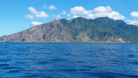 Big-pod-of-pilot-whales-surfacing-near-tropical-Atauro-Island-in-biodiverse-marine-ocean-waters-of-East-Timor,-Southeast-Asia