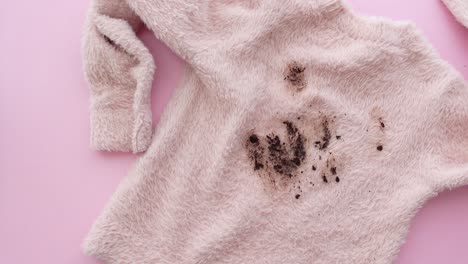 stained pink sweater