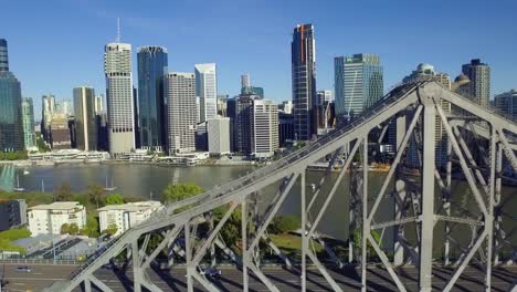 aerial shot of the story bridge showing the superstructure and deck, with the brisbane cbd in the background