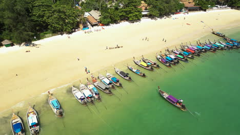 Aerial-over-long-tail-boats-boats-at-Railay-Beach-in-Ao-Nang,-Krabi,-Thailand
