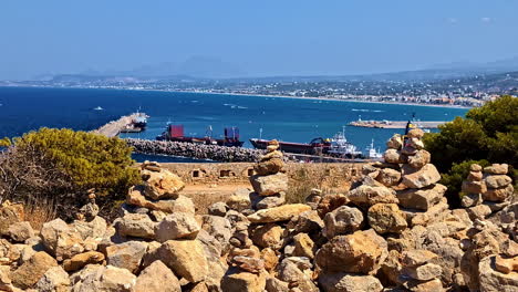 pile of stones overlooking venetian harbor of rethymnon in crete, greece