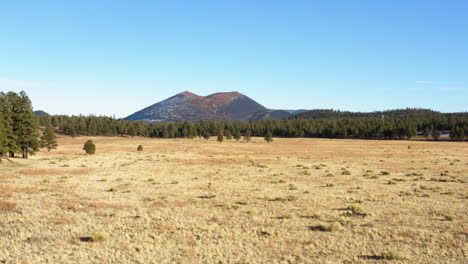 low aerial view over the sunset crater national monument in new mexico