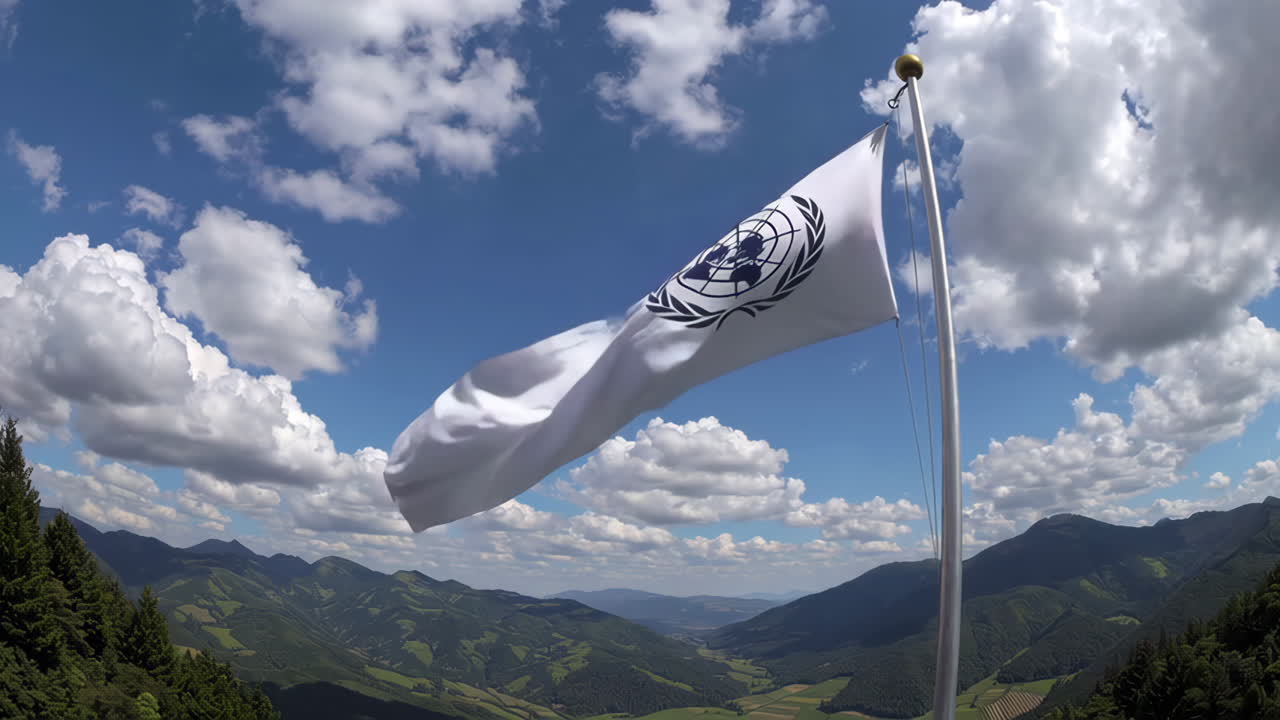 United Nations Flag Flying Over Mountains
