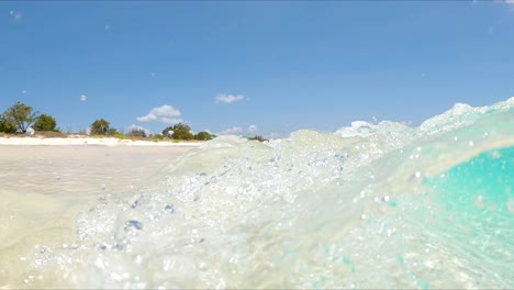 Extreme-Closeup-Of-Playa-Bahia-de-Las-Aguilas-Waves-With-Crystalline-Water-In-The-Dominican-Republic