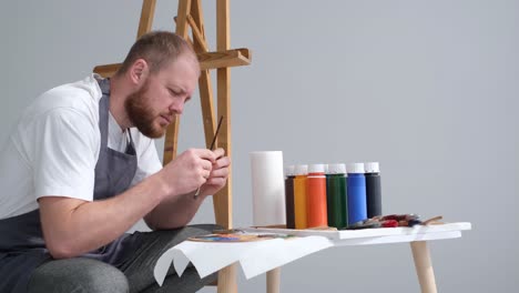 the process of mixing oil and paints that create multicolored bubbles