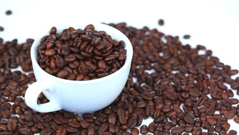 cup filled with coffee beans rotating