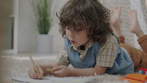 child drawing on carpet