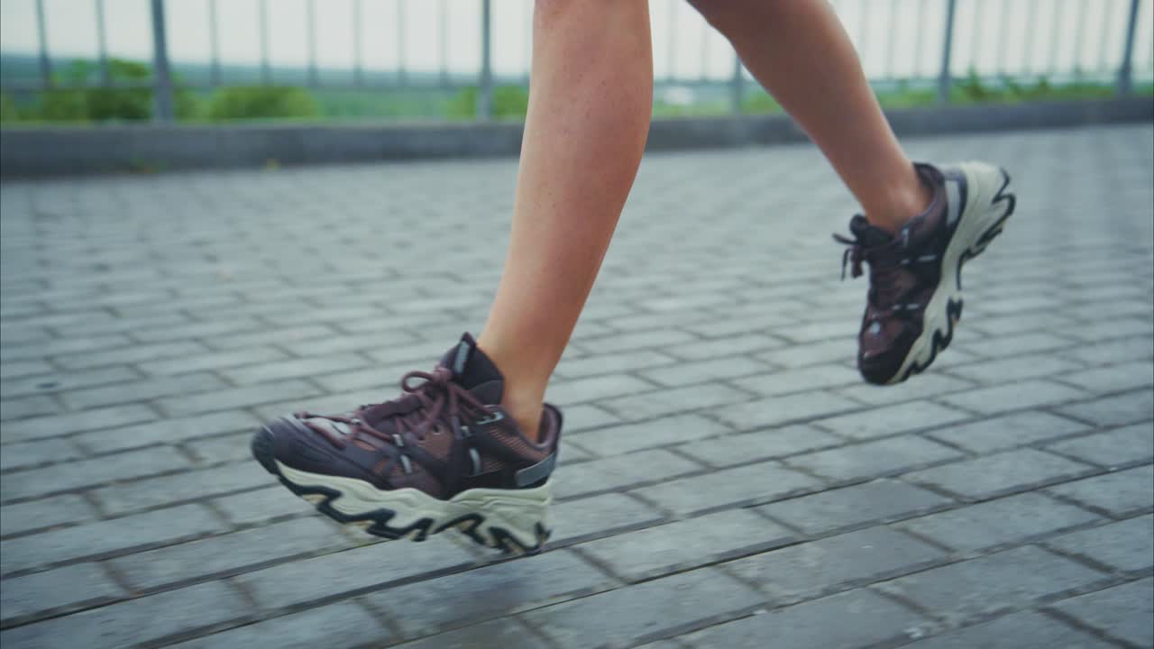 Running shoes on pavement