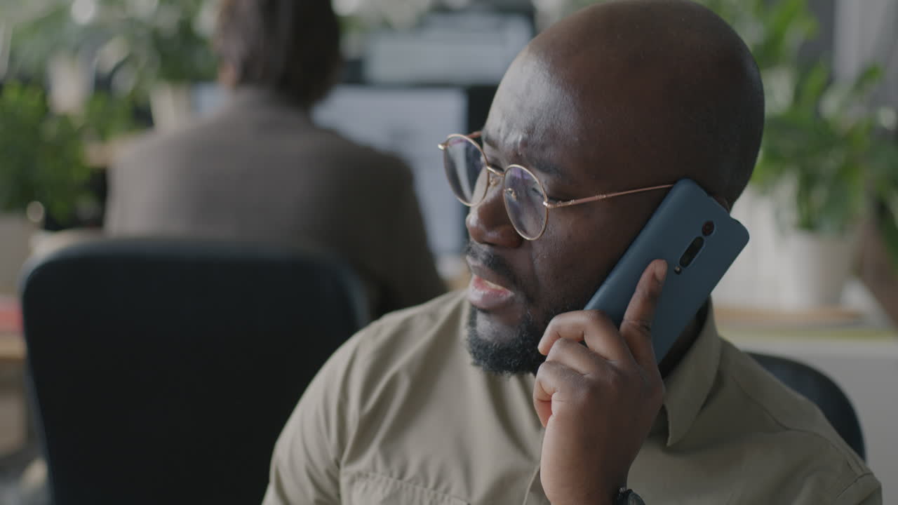 Man on Phone Call in Office