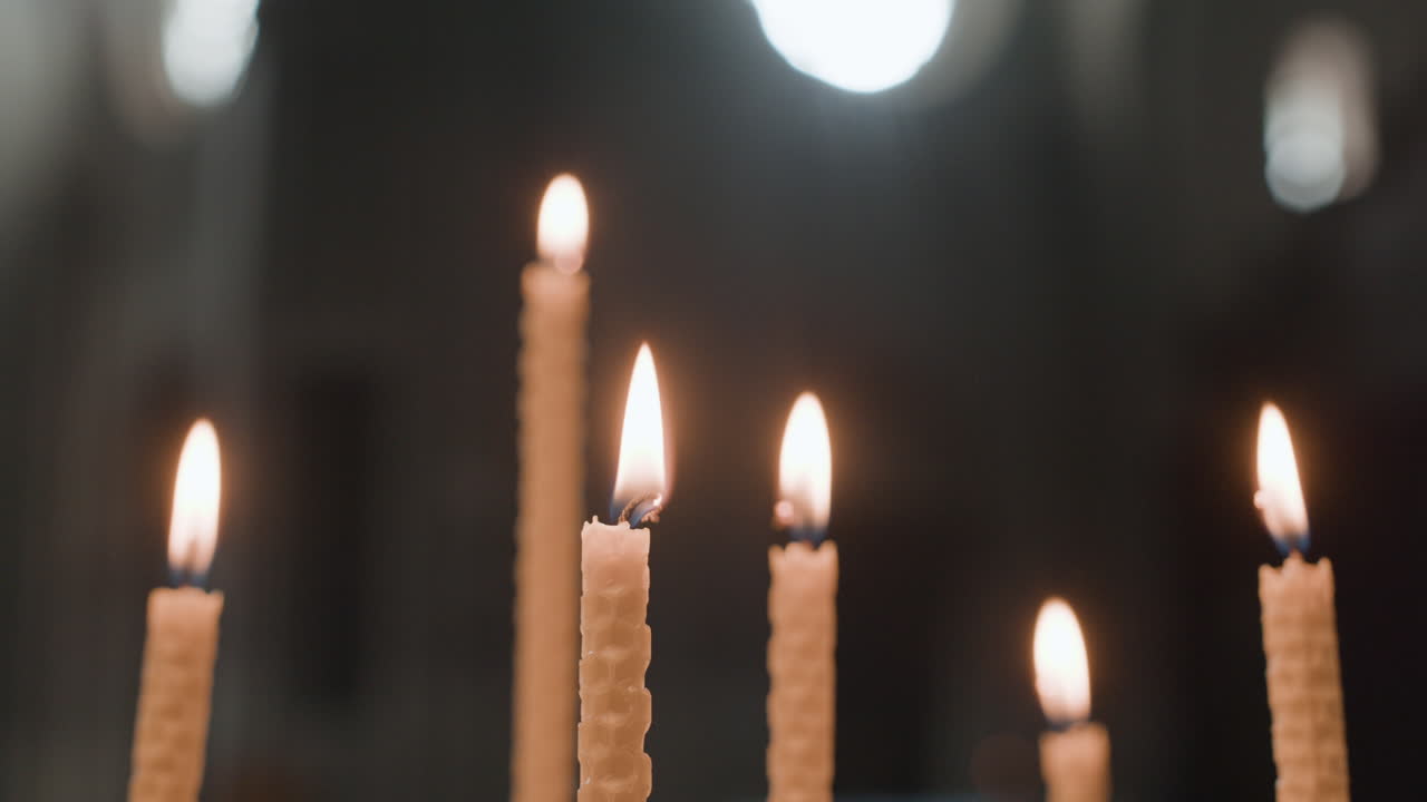 Candles Burning in a Dark Room