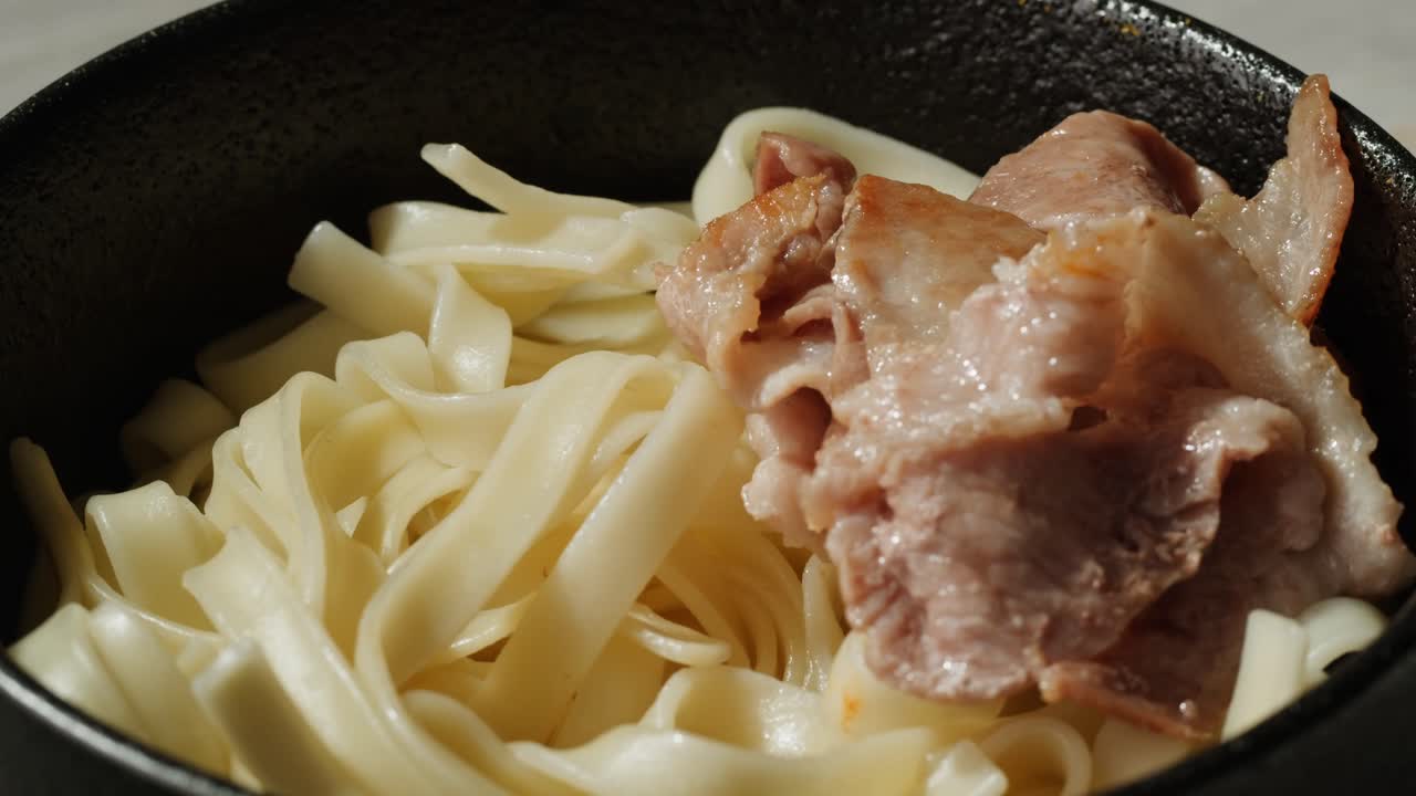 Bowl of Noodles with Bacon and Egg