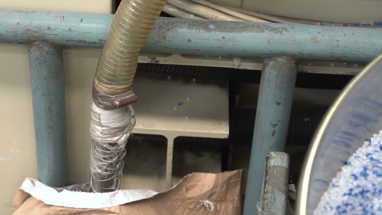 Vacuum pipe sucking plastic on factory