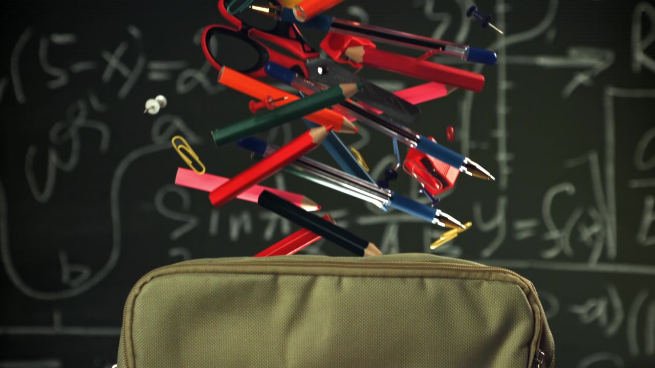 Colorful School Supplies Falling into a Pencil Case