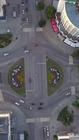 aerial view of a busy city intersection with roundabout