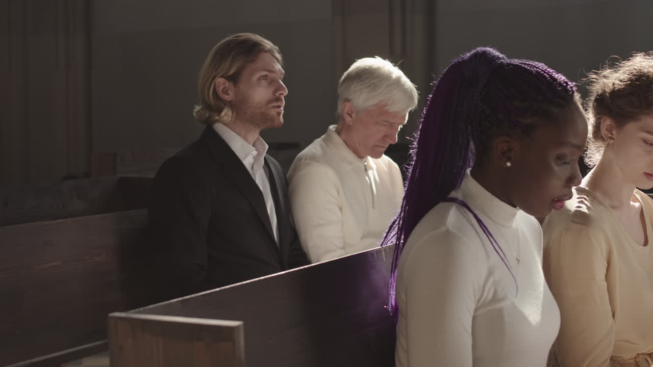 Four People Reading Bible in Church during Sunday Service