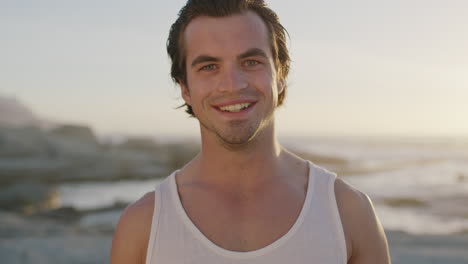 portrait of charming young man smiling close up of fit attractive man on beach