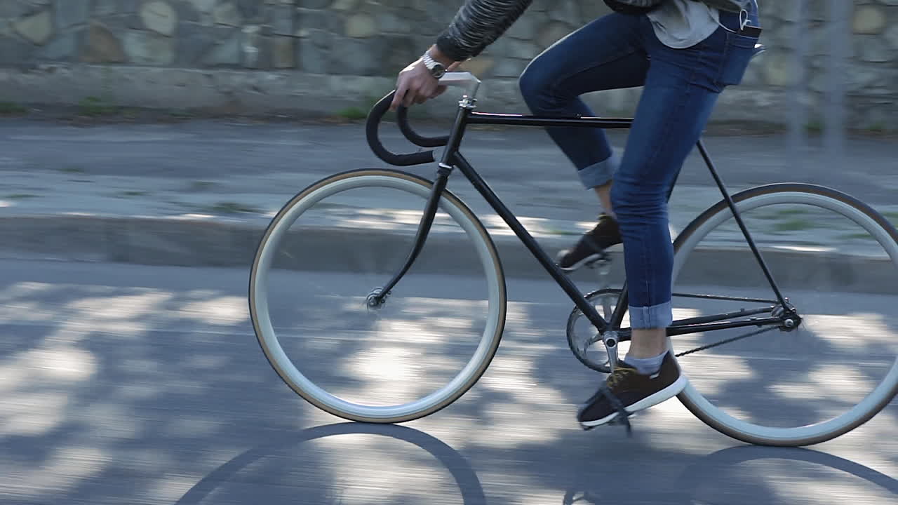Man riding a fixed gear bicycle on the street