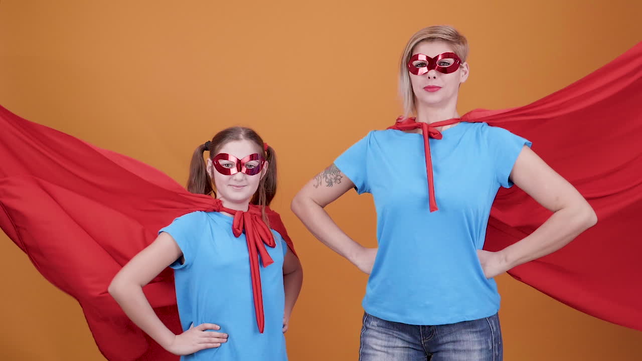 Mother and daughter dressed as superheroes