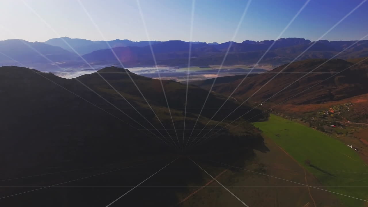 Mountain ridge silhouette spanning flat design, sunbeams slicing sky, farmland unfolding below