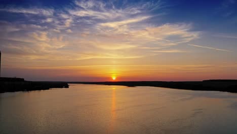 sun over skyline. countryside landscape under scenic colorful sky