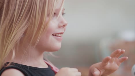 A-fair-haired-little-girl-looks-amazed-and-surprised-after-seeing-the-magic-trick